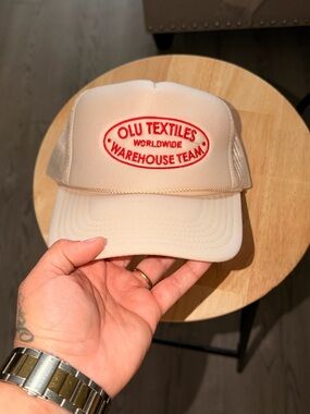 Beige Trucker Hat with Red Embroidered Logo